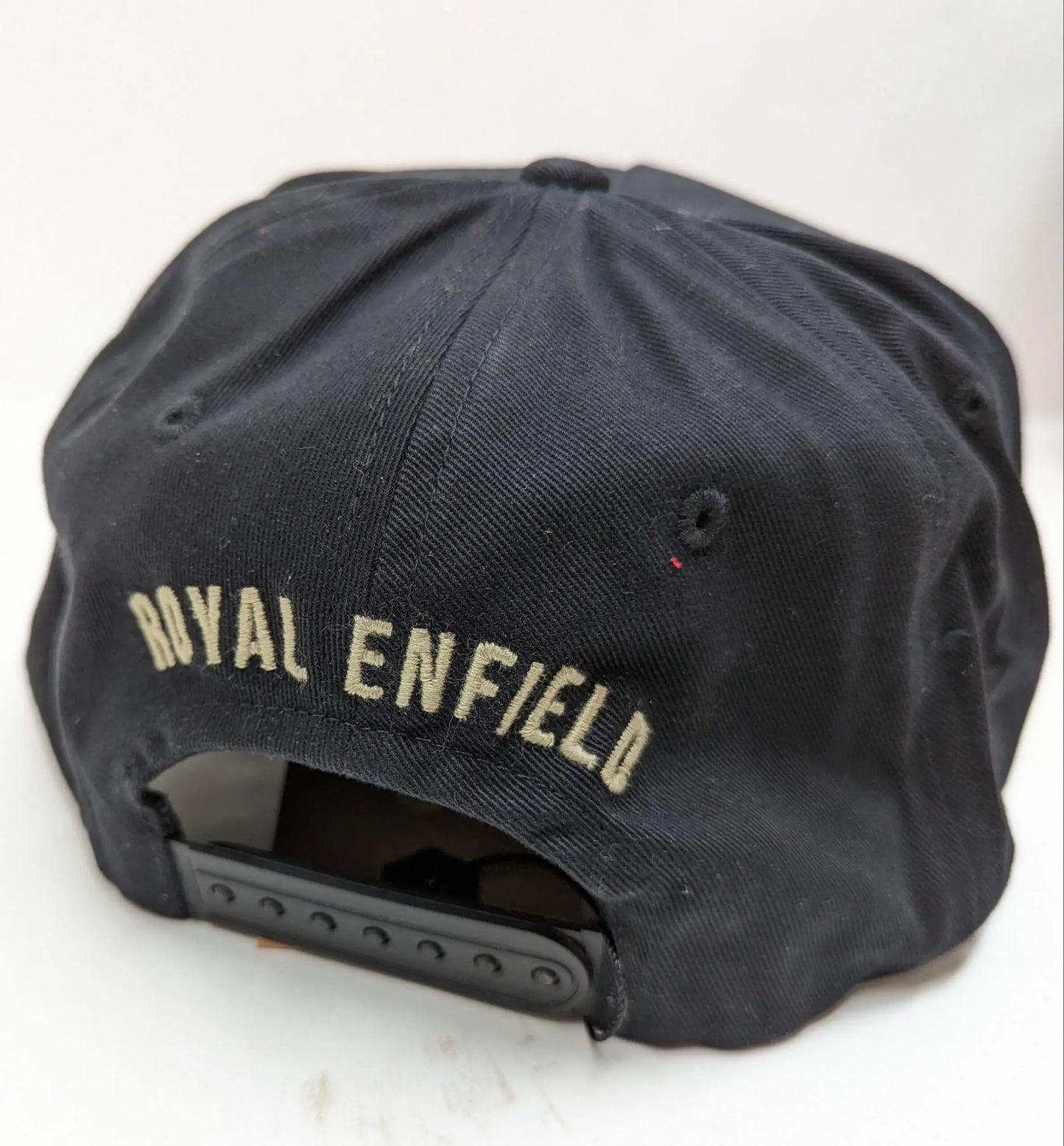 Black cap with 'Royal Enfield' branding on the back
